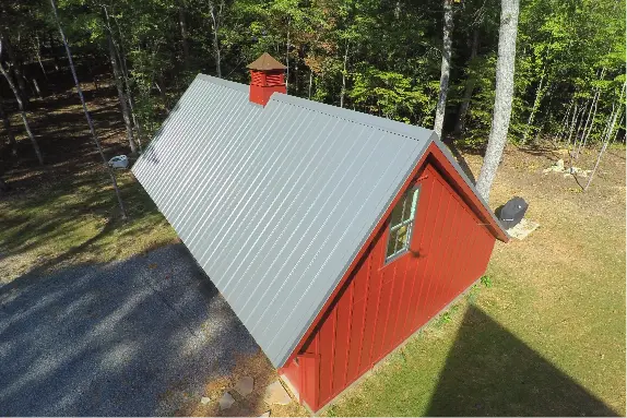 Red shed with a grey metal roof