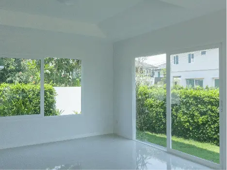 White room with a window and sliding door
